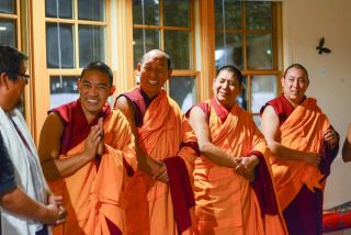 Monks smiling