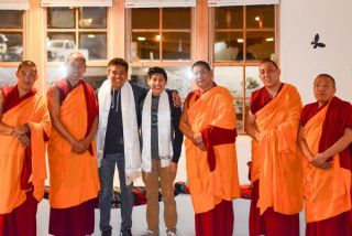 Students pose with monks