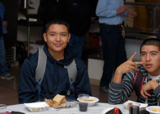 Tenzin and Carlos eating Christmas Dinner